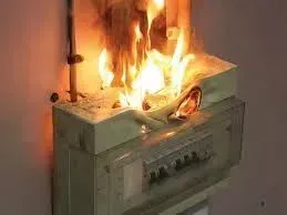A fire is coming out of a electrical box.