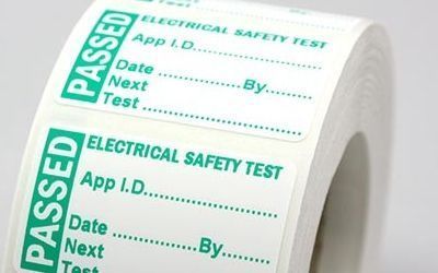 A roll of passed electrical safety test labels